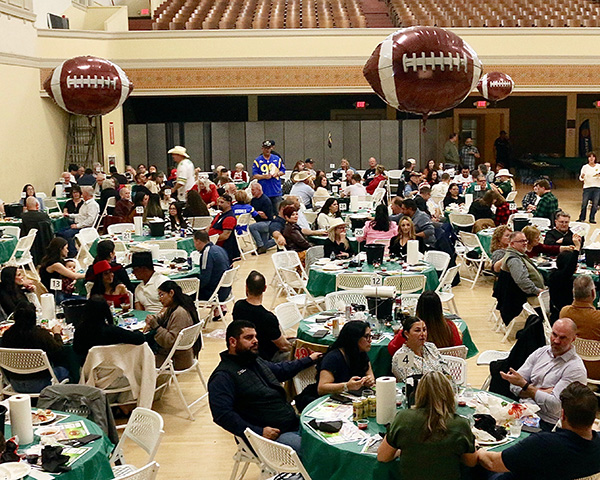 Full hall of tables and diners