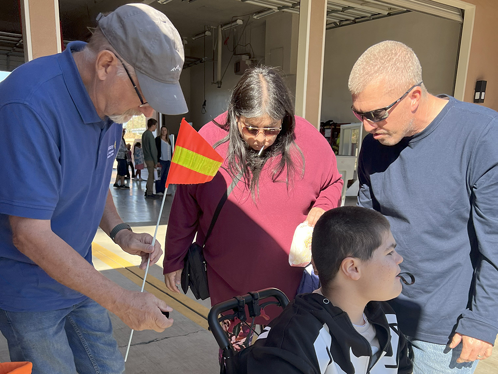 Rotarian fitting flag to wheelchair