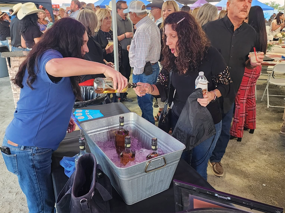 Rotarian pouring bourbon.